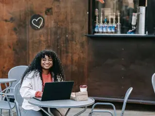 A woman eating outdoors