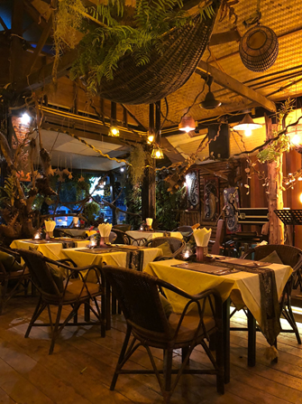A restaurant with flowery decorations A restaurant with flowery decorations