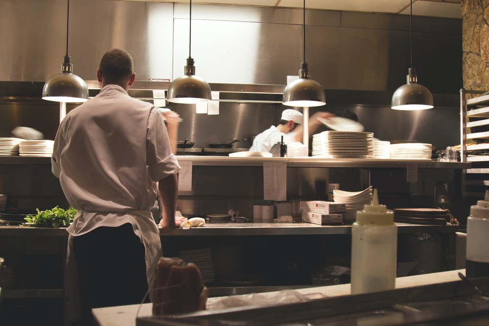 A line cook working in a kitchen