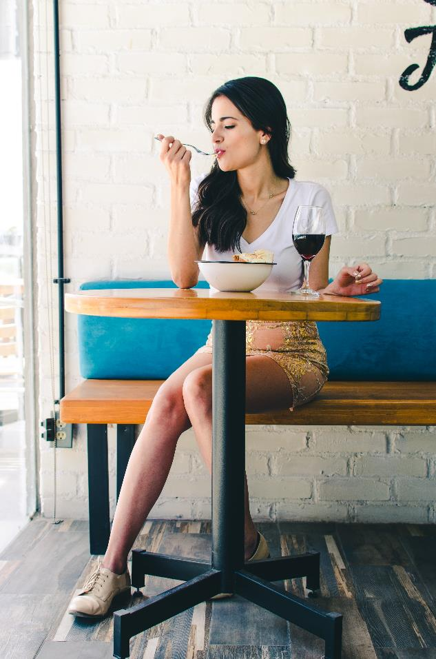 A girl eating soup