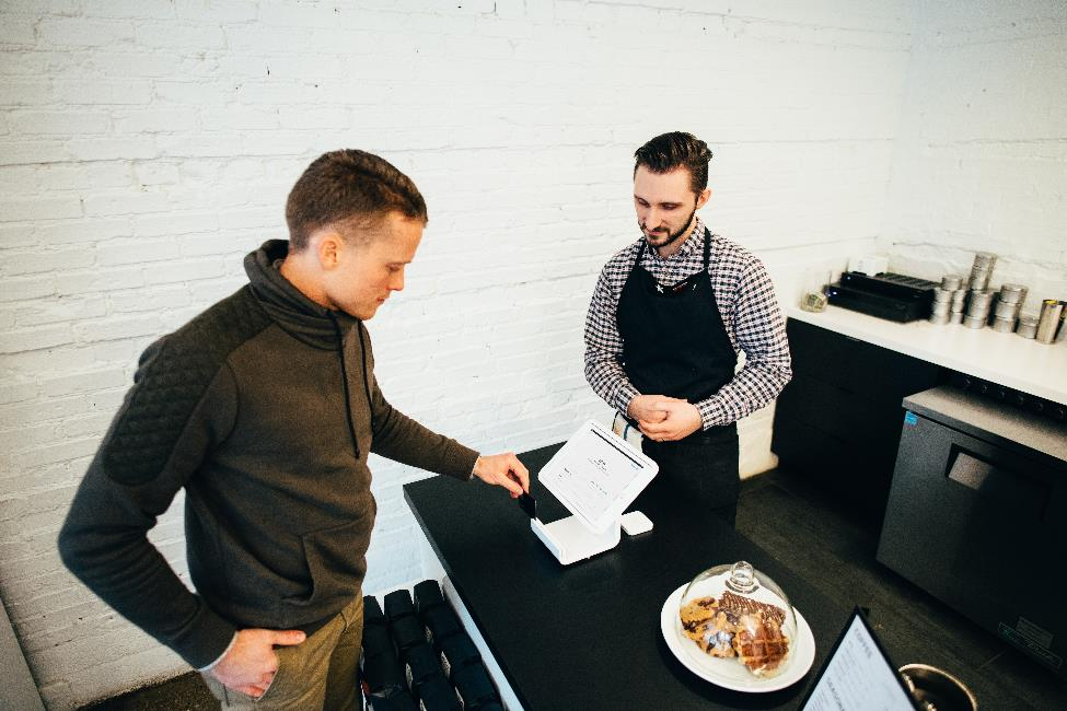 A server helping a customer