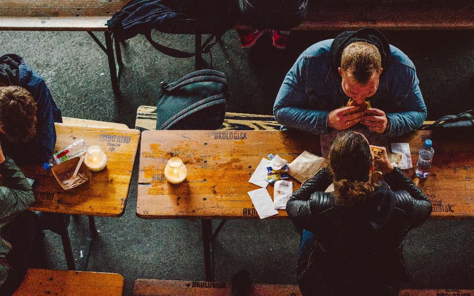 People eating sandwiches in a restaurant