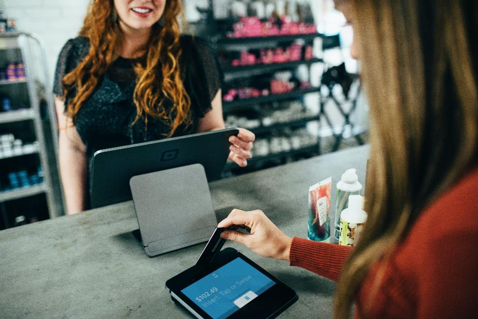 A person using the card on a POS machine