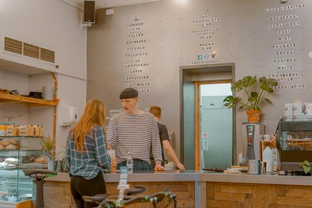 An employee serving a customer