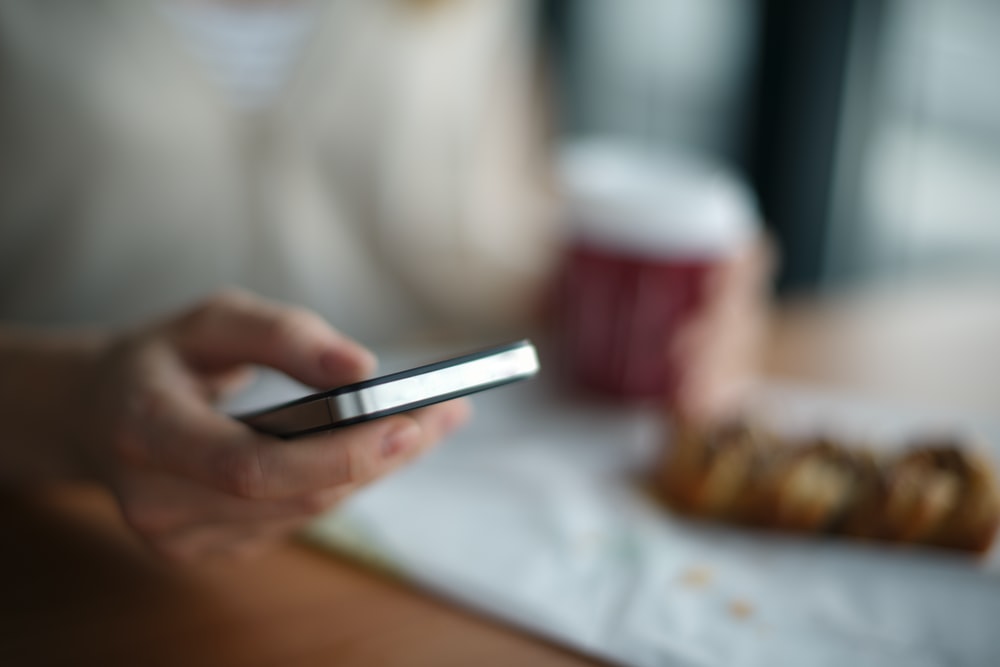 A person using their phone to order food